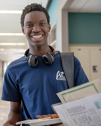 Wheaton High School ACES Student Standing with their lunch in hand