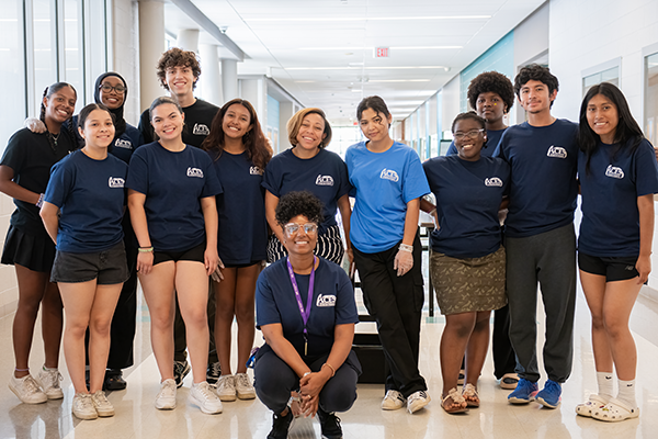 A Group Of Wheaton High School Volunteers And Coordinators Smiling And Posing For A Picture