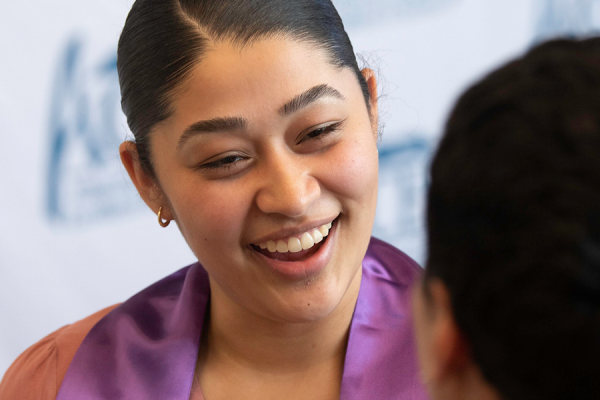 Aces Students Talking At A Graduation Event